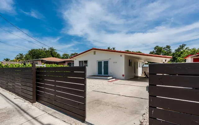 a view of a house with a street