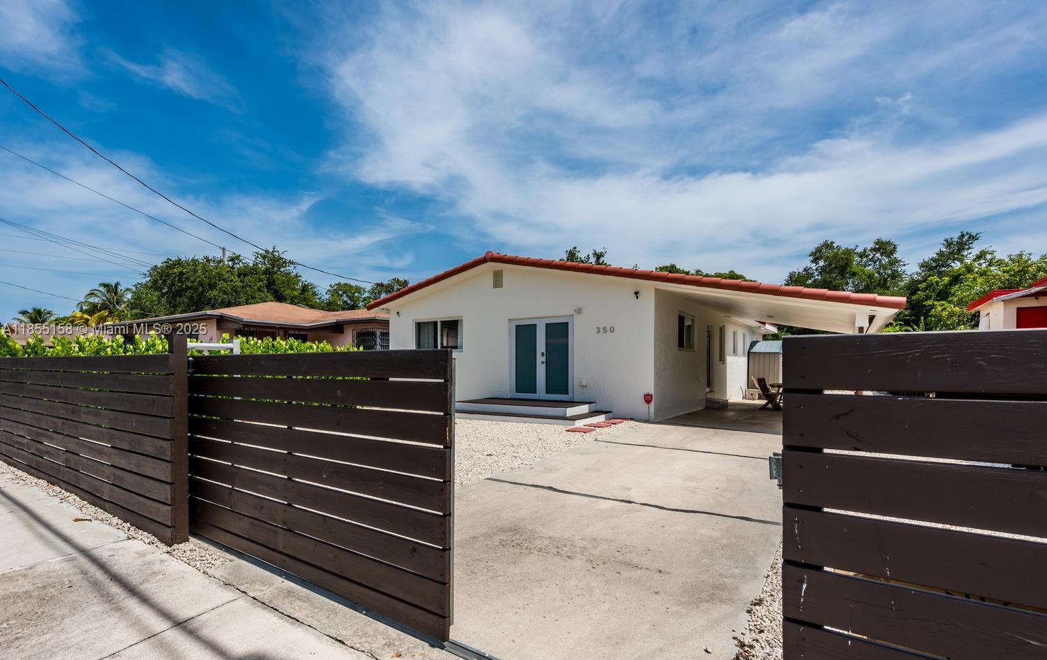 350 Northwest 50th Street Miami, FL 33127 - Photo 3 of 27 a view of a house with a street