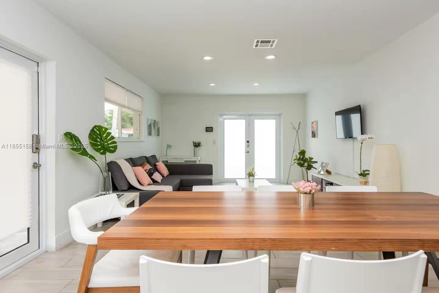350 Northwest 50th Street Miami, FL 33127 - Photo 6 of 27 a view of kitchen with dining area