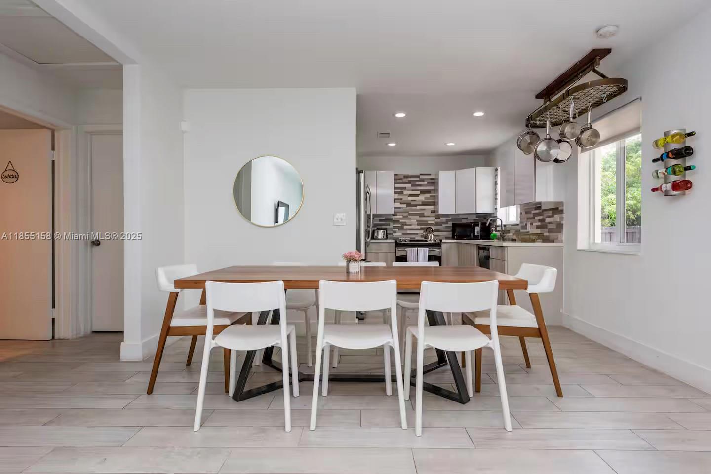 350 Northwest 50th Street Miami, FL 33127 - Photo 8 of 27 a view of a dining room with furniture