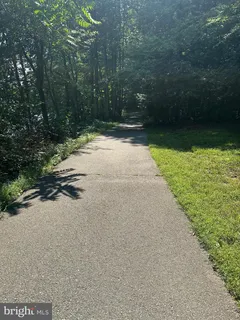 a view of swimming pool with a yard