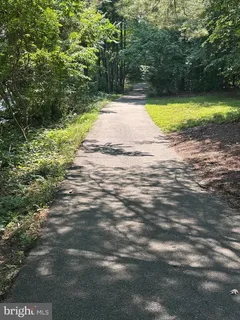 a kitchen with stainless steel appliances granite countertop a refrigerator stove and sink
