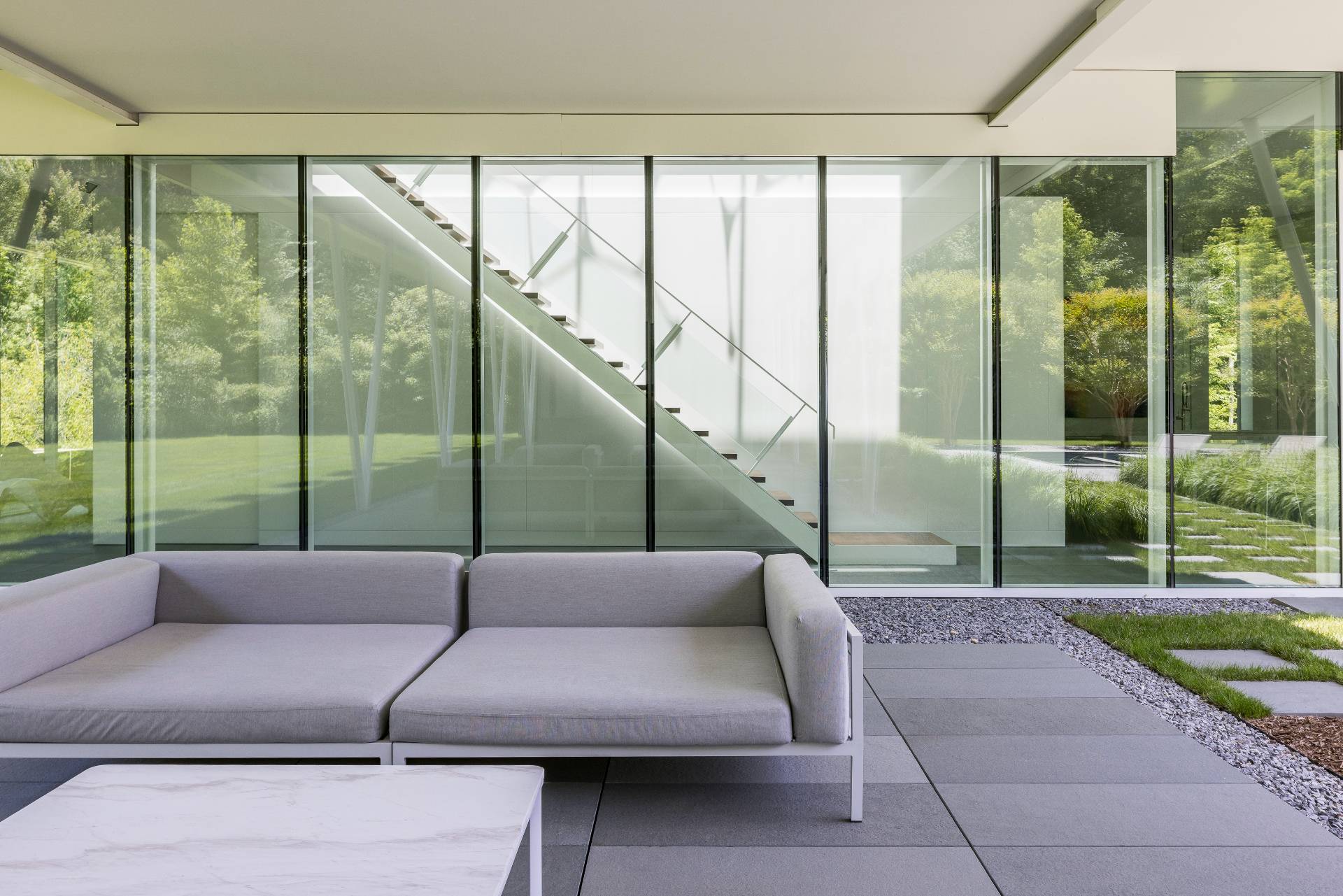 13 Terry's Trail East Hampton, NY 11937 - Photo 15 of 46 a living room with a couch and a large window