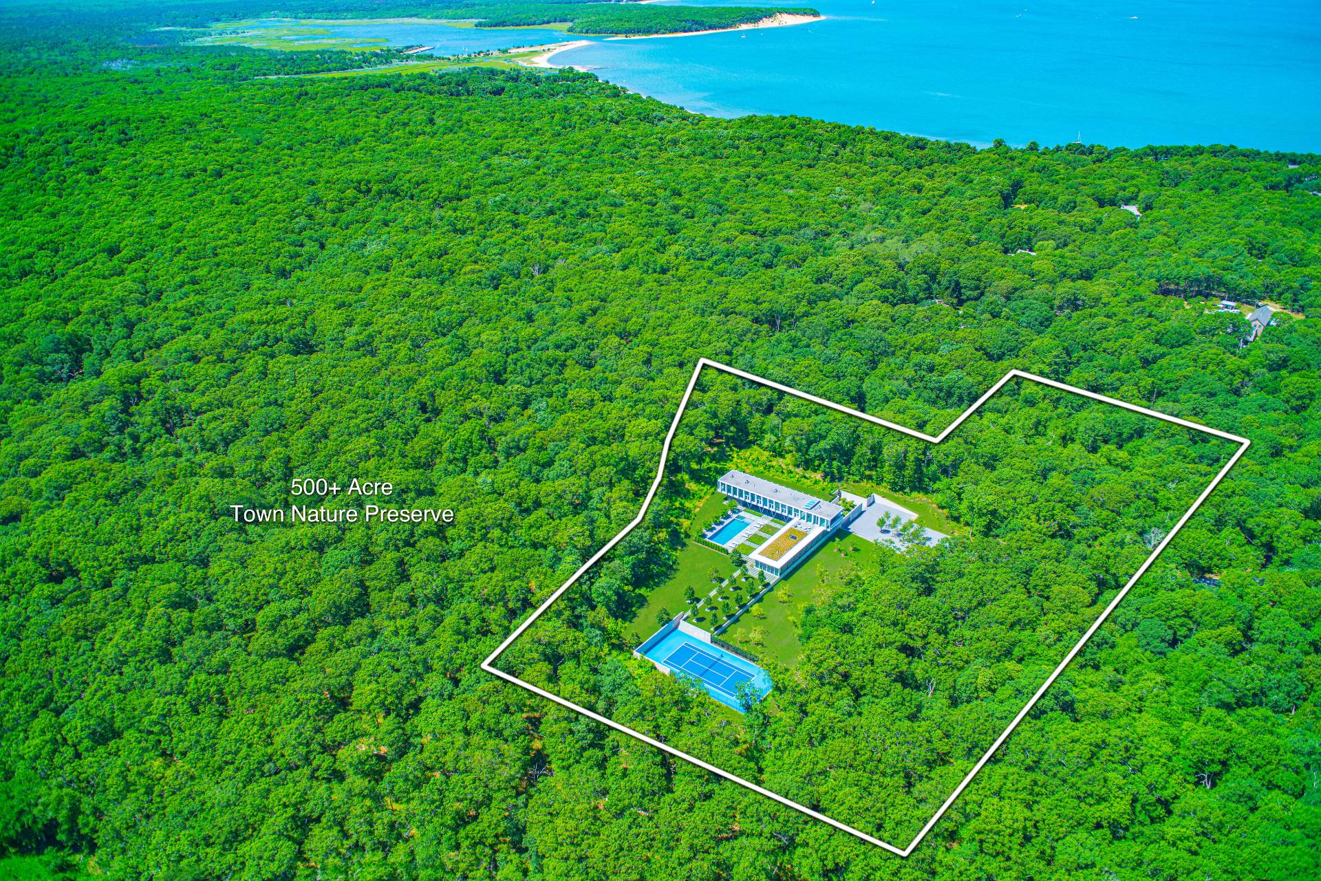 13 Terry's Trail East Hampton, NY 11937 - Photo 18 of 46 a green field with lots of tress in it