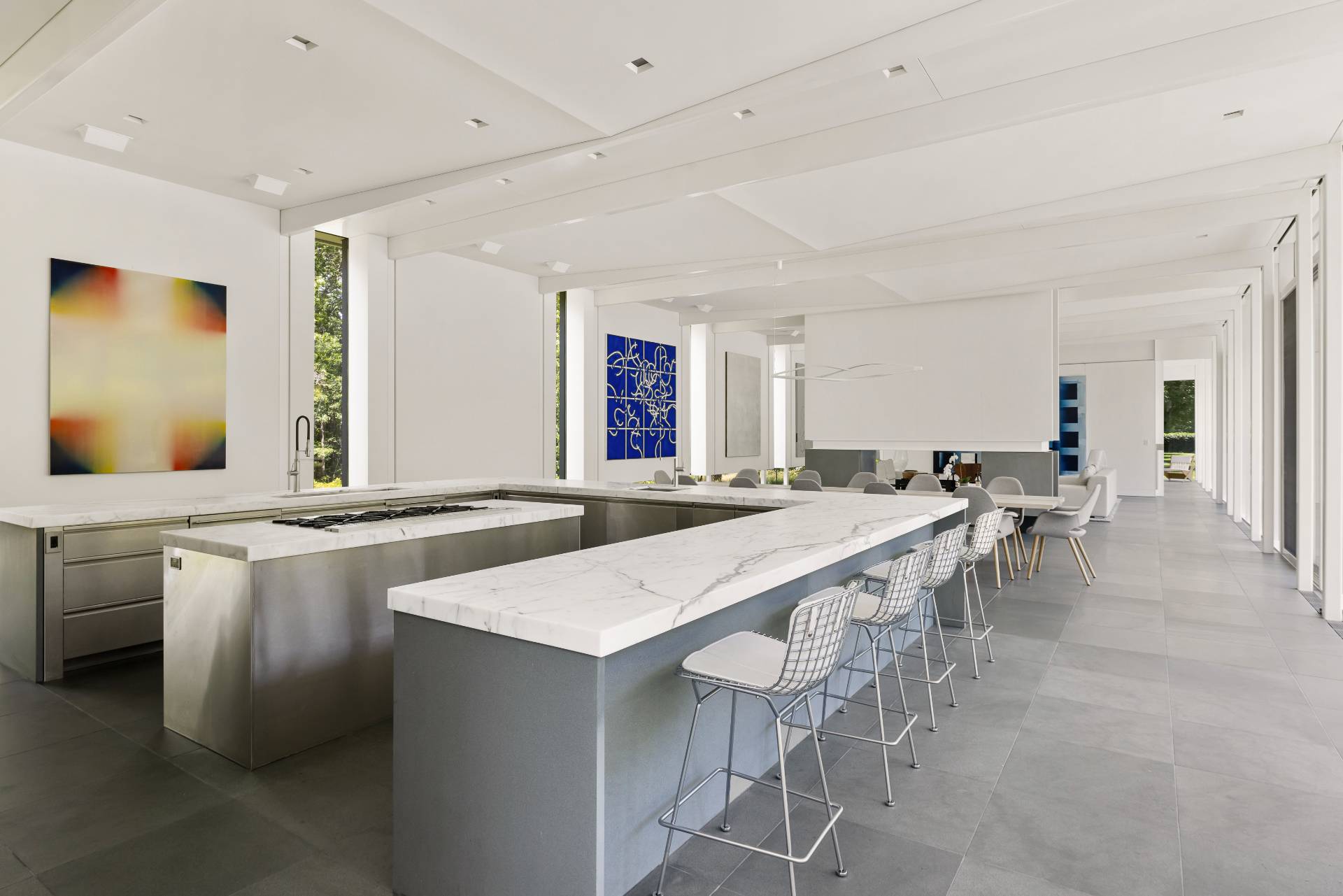 13 Terry's Trail East Hampton, NY 11937 - Photo 25 of 46 a large dining hall with stainless steel appliances granite countertop a stove a sink a dining table and chairs