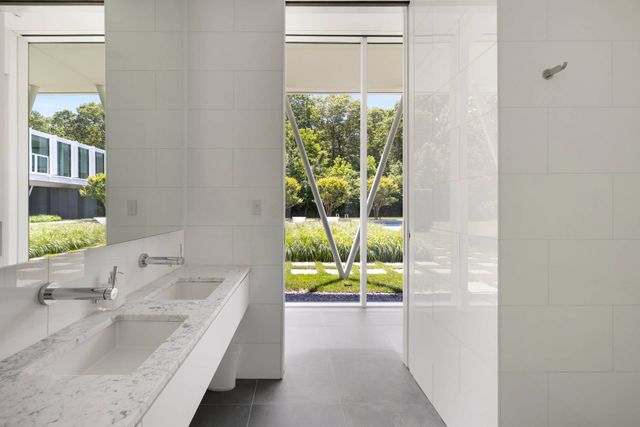 a bed room with a bed and a chair