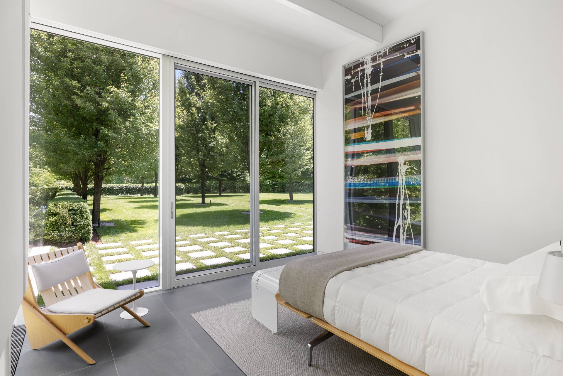 13 Terry's Trail East Hampton, NY 11937 - Photo 29 of 46 a bedroom with a bed and a couch next to a window