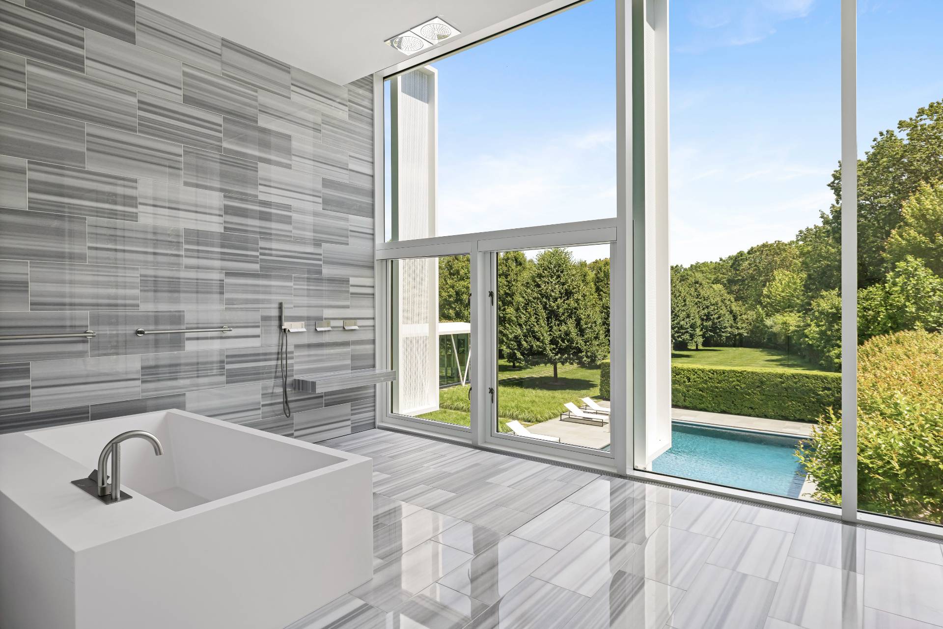 13 Terry's Trail East Hampton, NY 11937 - Photo 33 of 46 a bathroom with a sink a bathtub and next to a window