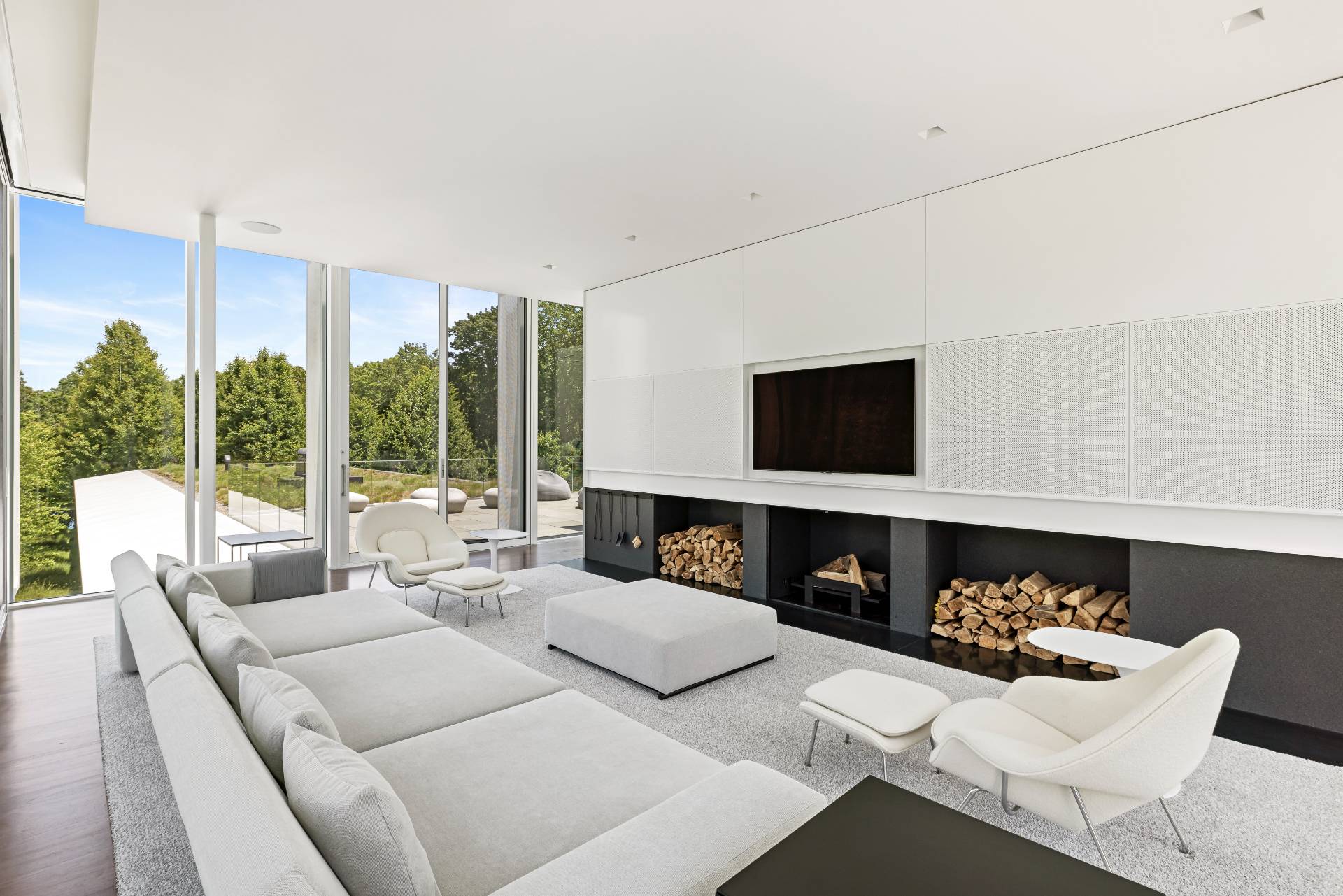 13 Terry's Trail East Hampton, NY 11937 - Photo 35 of 46 a living room with furniture a fireplace and a flat screen tv