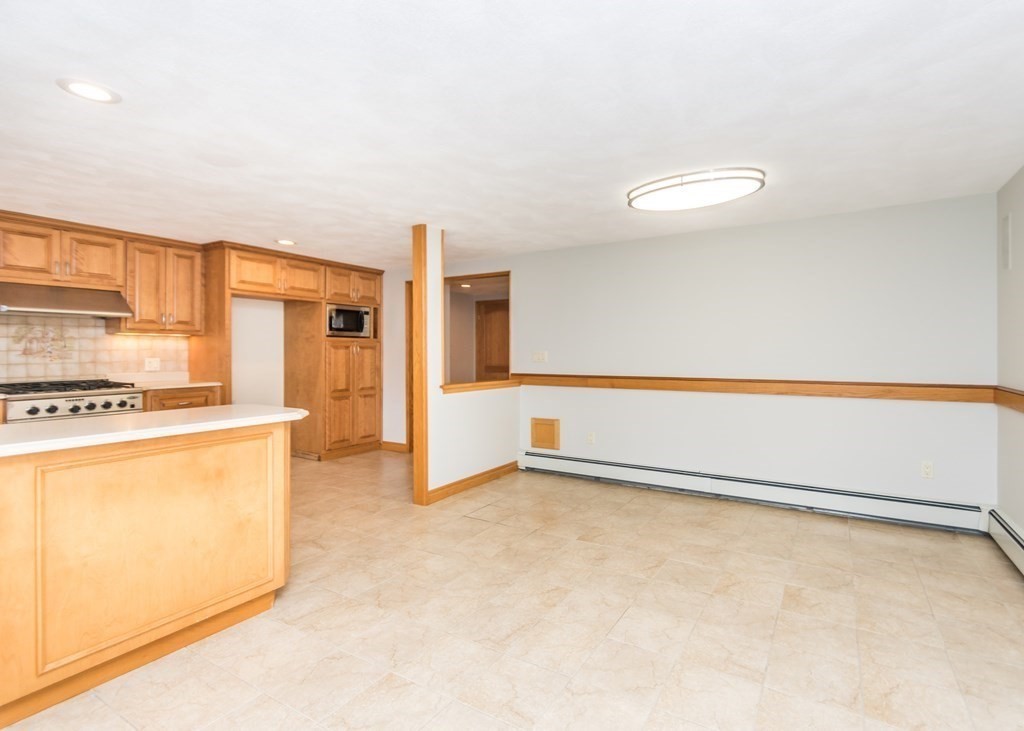 129 Beal Road Waltham, MA 02453 - Photo 13 of 31 a view of kitchen with cabinets and refrigerator