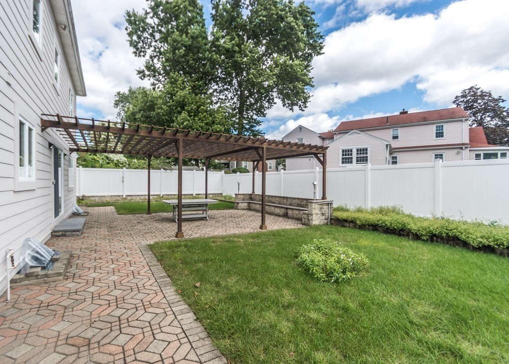129 Beal Road Waltham, MA 02453 - Photo 27 of 31 a view of a house with backyard and sitting area