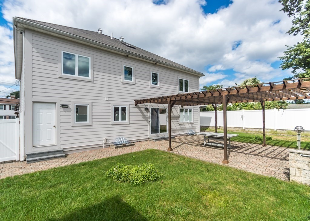 129 Beal Road Waltham, MA 02453 - Photo 28 of 31 a view of a house with backyard and sitting area