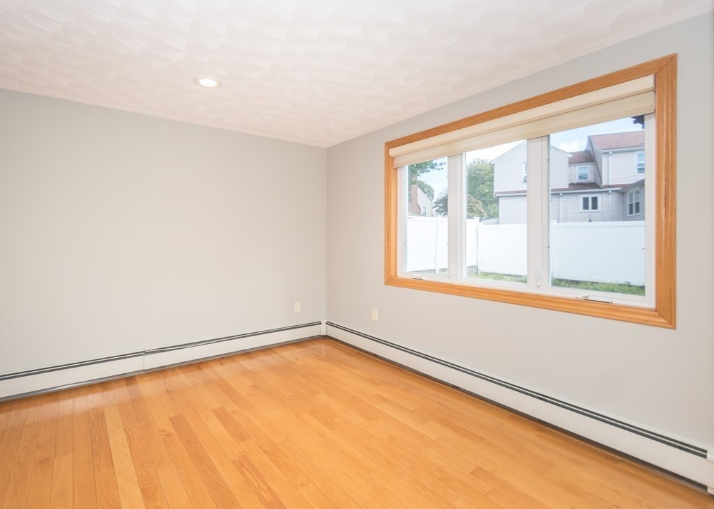 129 Beal Road Waltham, MA 02453 - Photo 6 of 31 a view of an empty room with a window