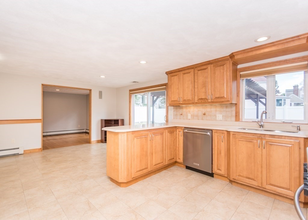 129 Beal Road Waltham, MA 02453 - Photo 10 of 31 a large white kitchen with granite countertop a sink