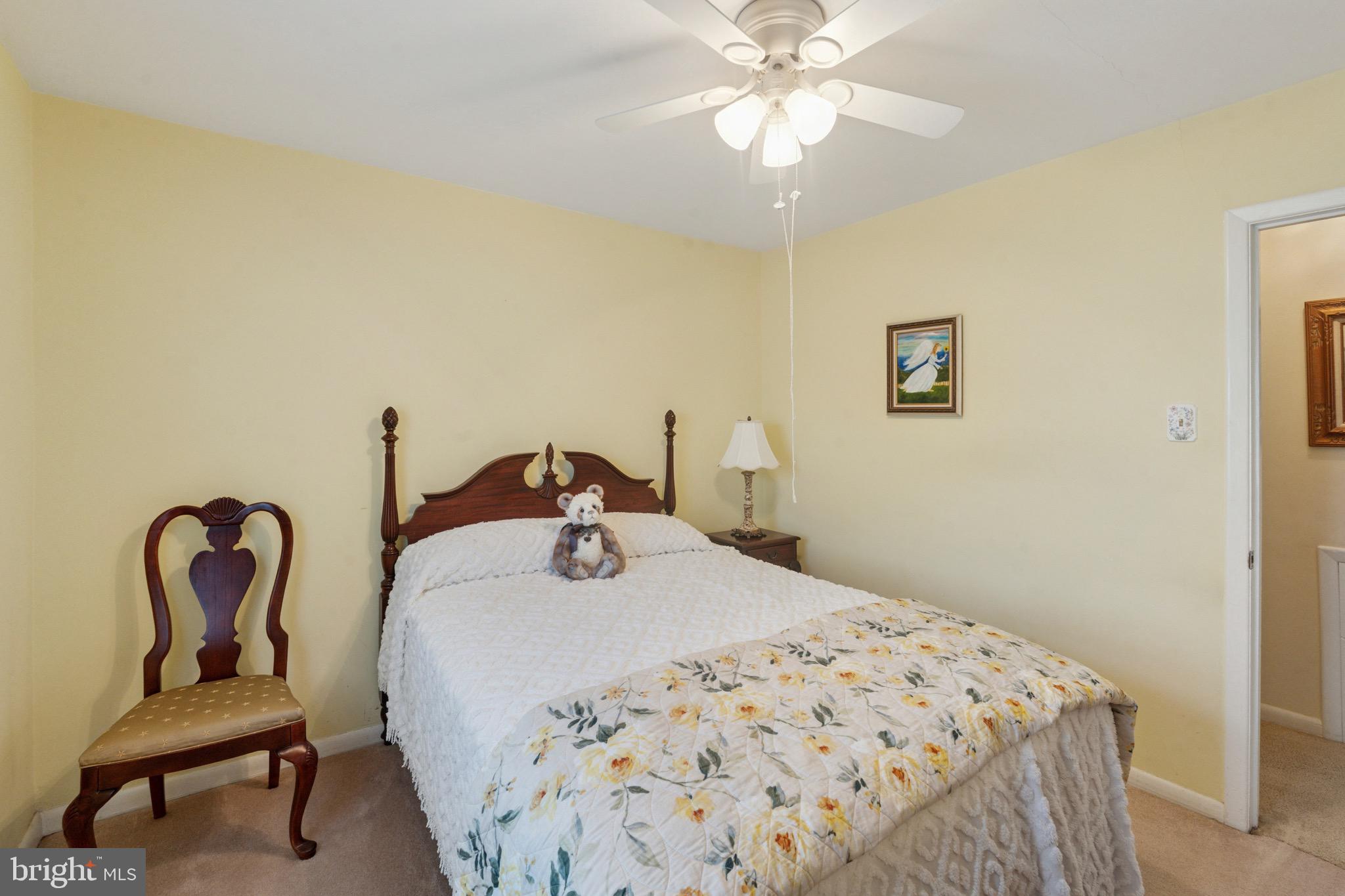 7026 Crease Lane Philadelphia, PA 19128 - Photo 17 of 41 a bedroom with a bed and a chair