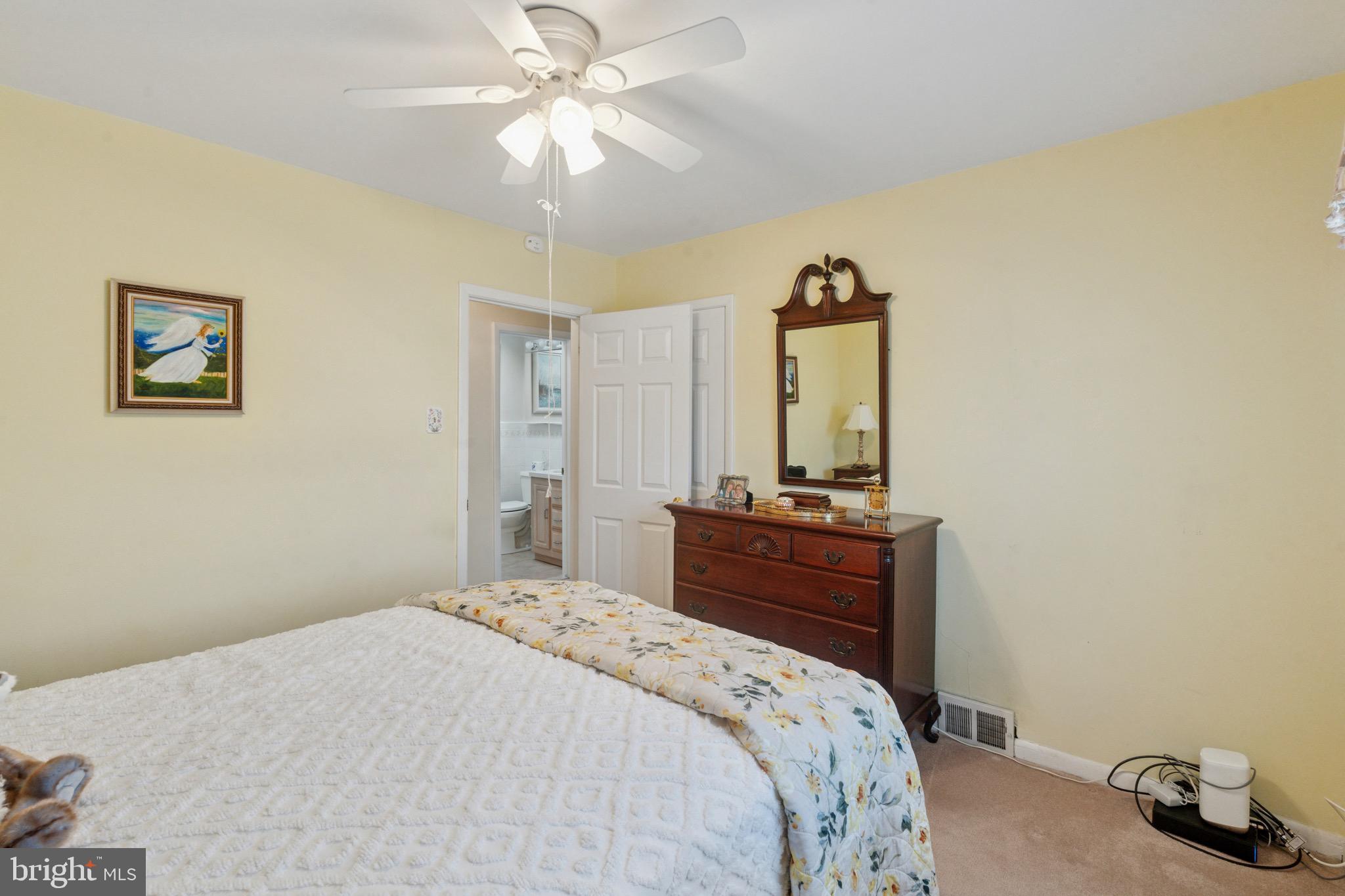 7026 Crease Lane Philadelphia, PA 19128 - Photo 18 of 41 a bedroom with a bed and a dresser
