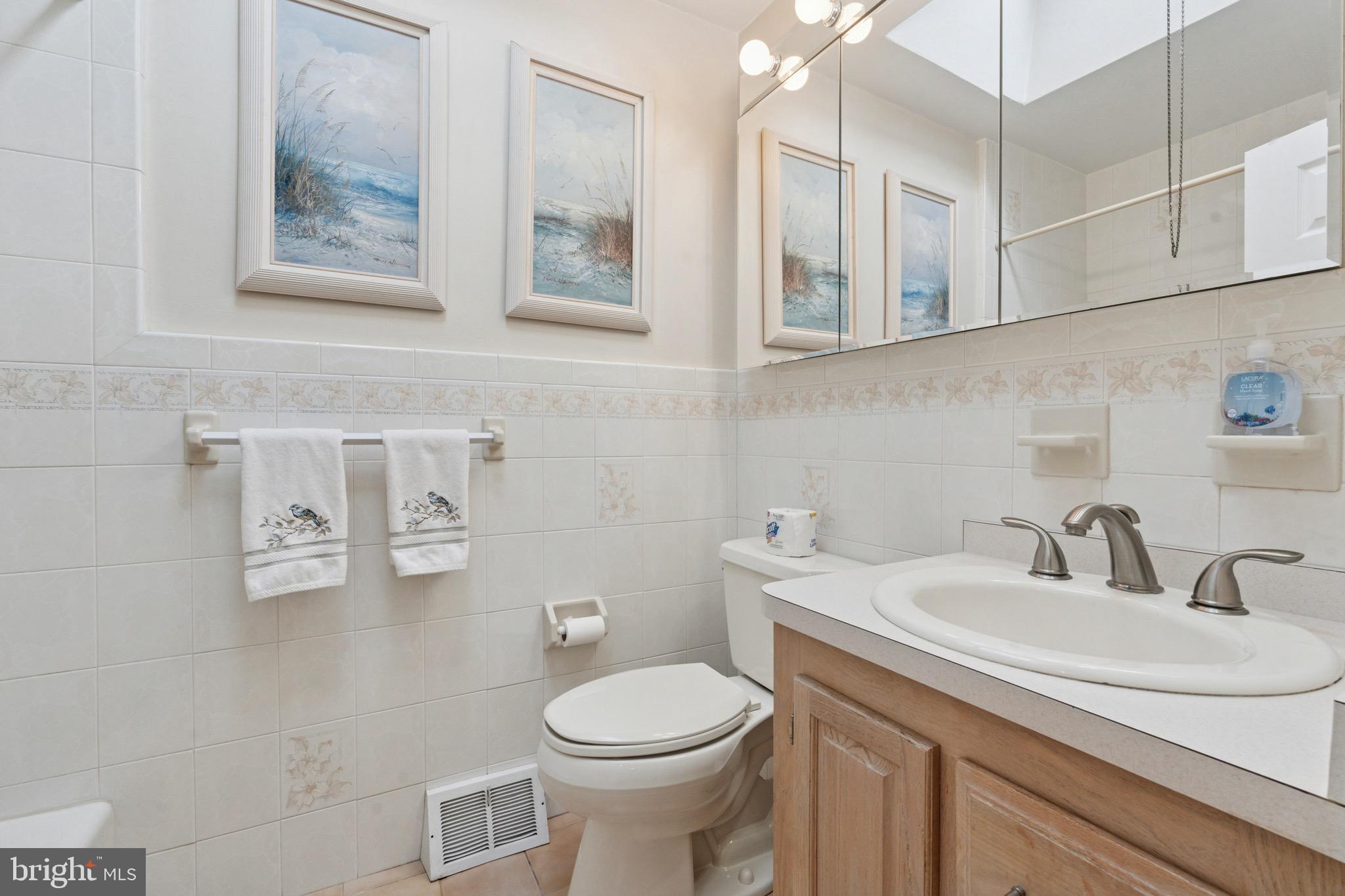 7026 Crease Lane Philadelphia, PA 19128 - Photo 19 of 41 a bathroom with a toilet sink and mirror