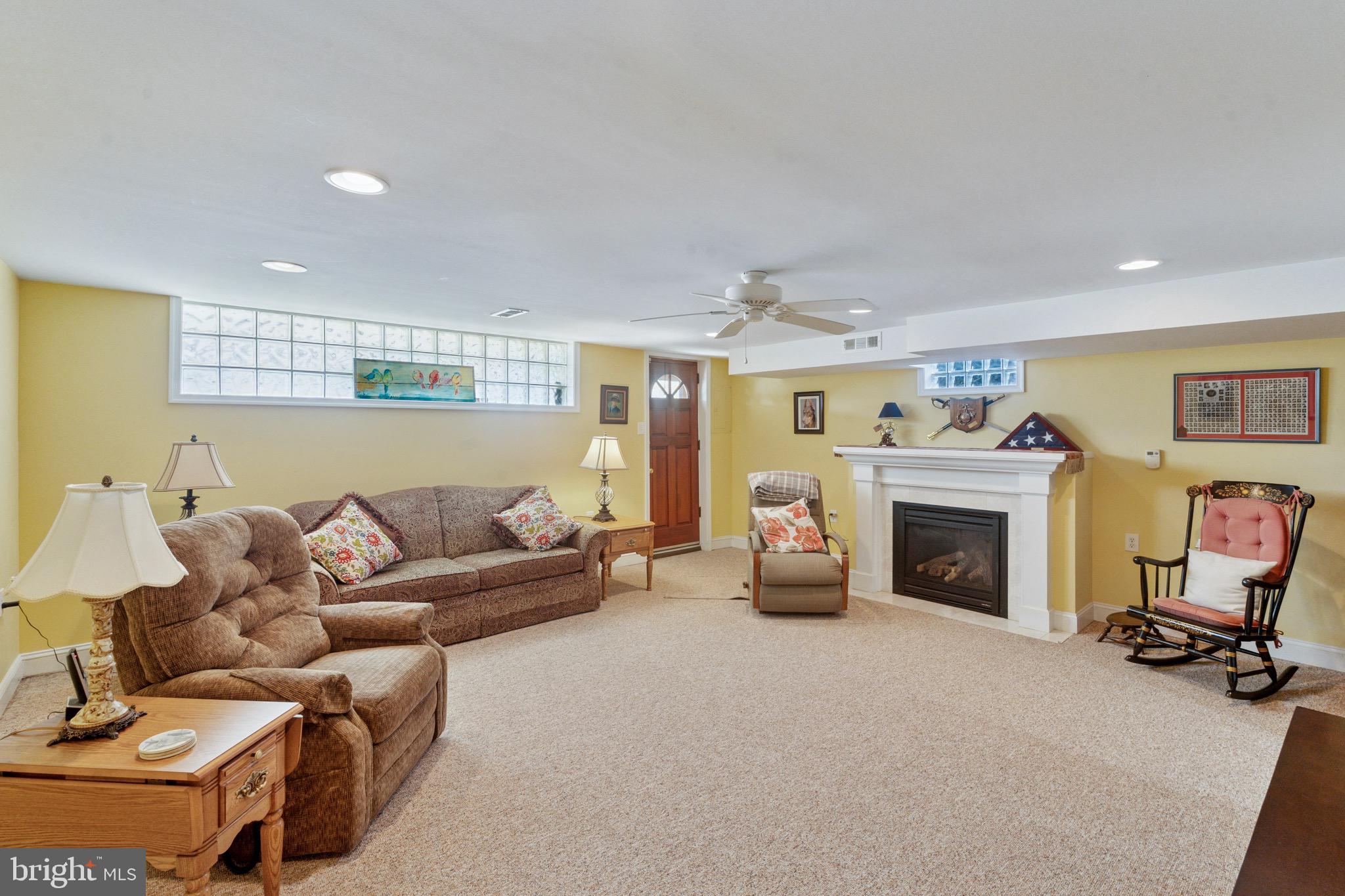 7026 Crease Lane Philadelphia, PA 19128 - Photo 32 of 41 a living room with furniture and a fireplace