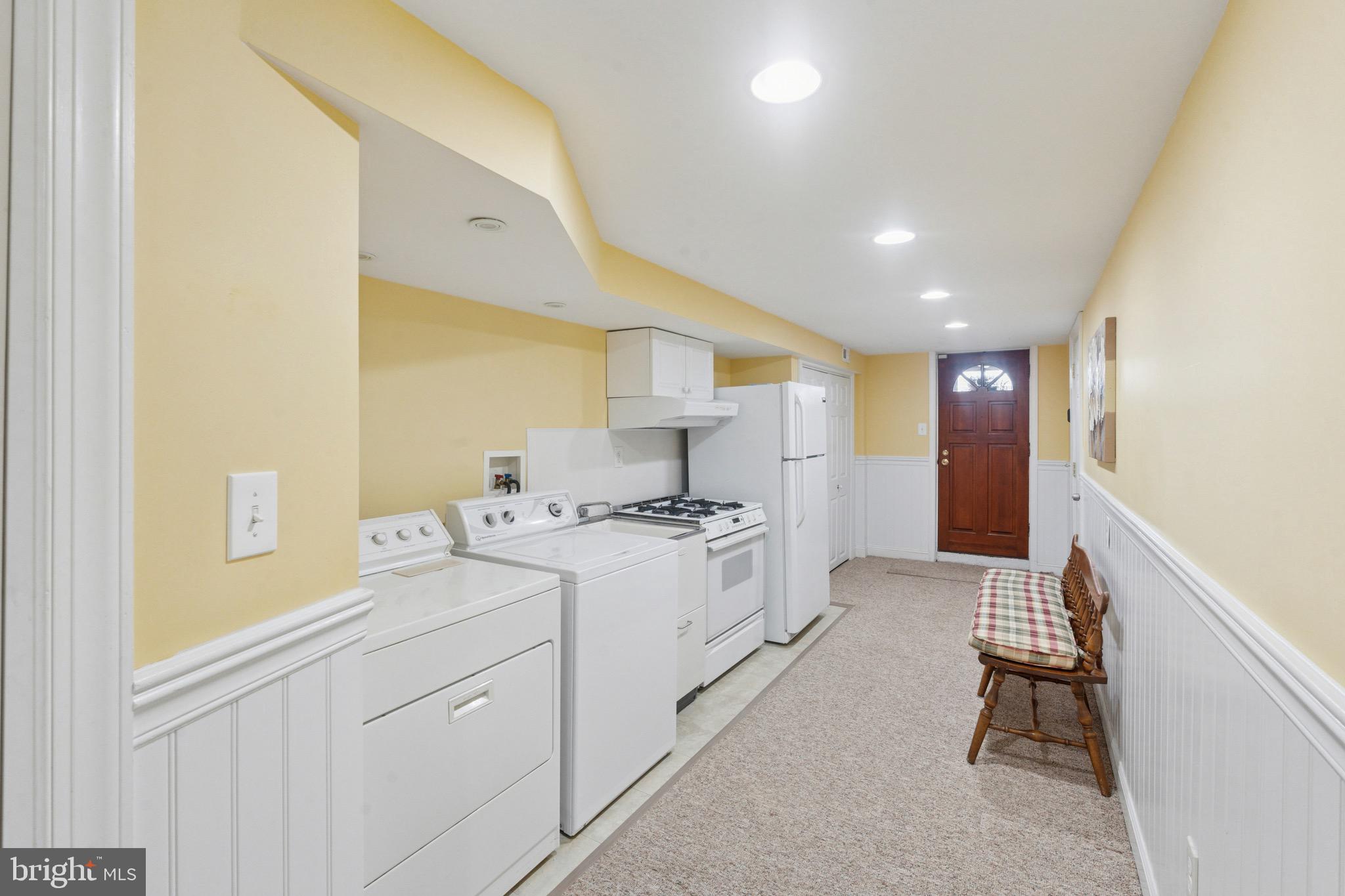 7026 Crease Lane Philadelphia, PA 19128 - Photo 34 of 41 a kitchen with stainless steel appliances white cabinets and a refrigerator