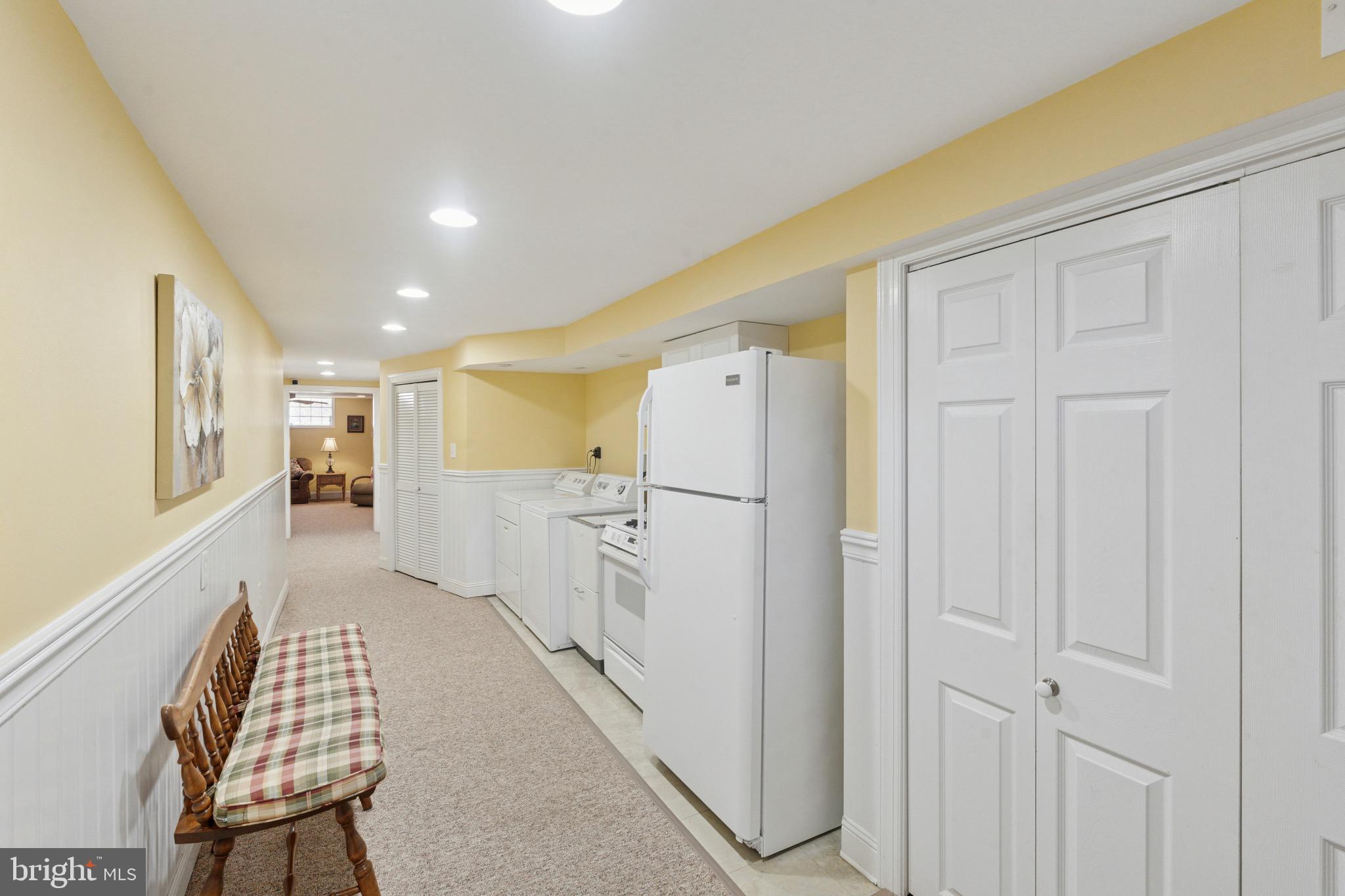 7026 Crease Lane Philadelphia, PA 19128 - Photo 35 of 41 a view of a hallway with wooden cabinets and staircase