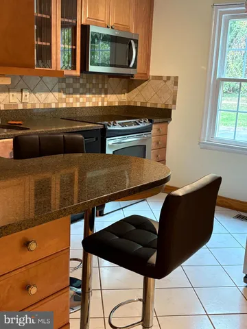 a kitchen with a sink and a window
