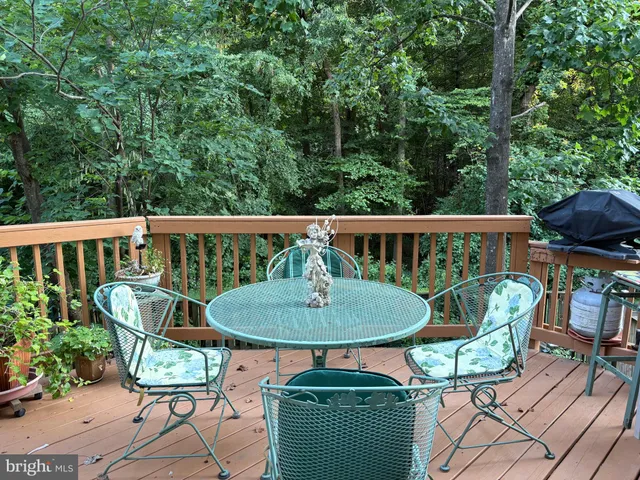 an outdoor sitting area with furniture