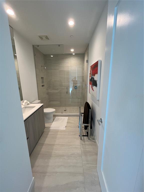 301 Quay Commons, Unit 1808 Sarasota, FL 34236 - Photo 11 of 12 a bathroom with a sink and mirror