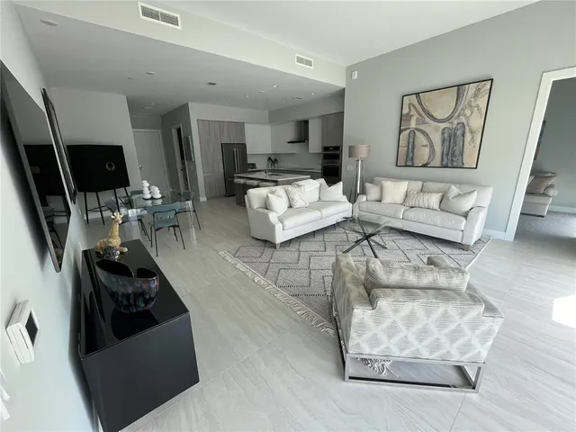 a living room with furniture and a rug