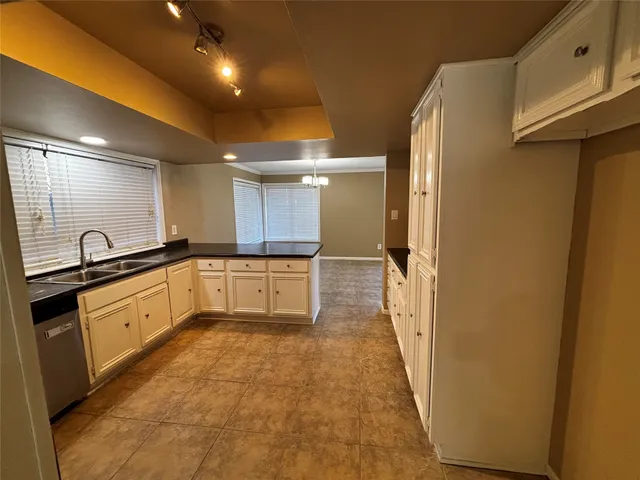a large bathroom with a sink and a large mirror