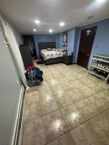 a lobby with furniture and a flat screen tv