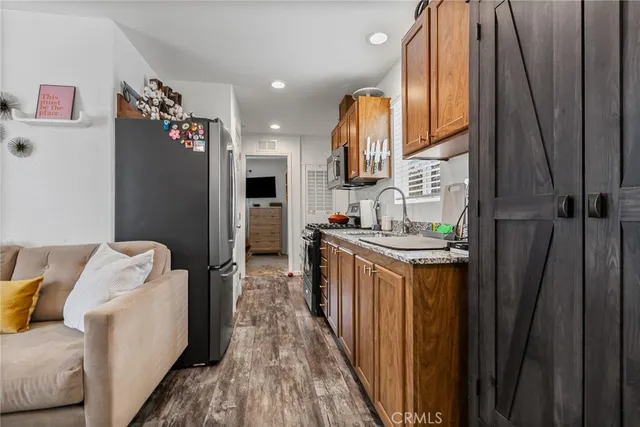 a kitchen with refrigerator and window