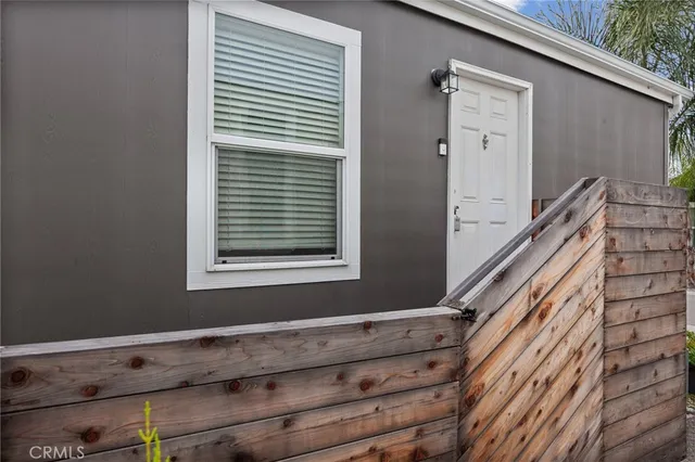 a view of wooden floor and a window