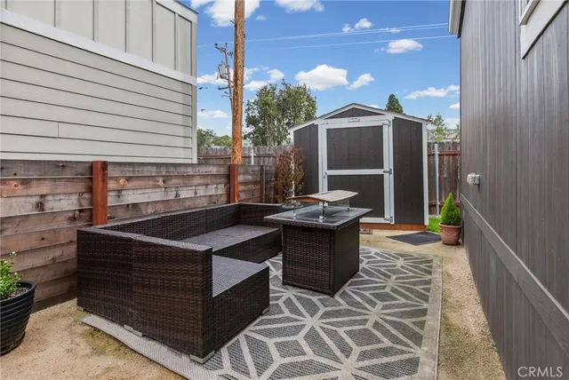 a view of backyard with outdoor seating