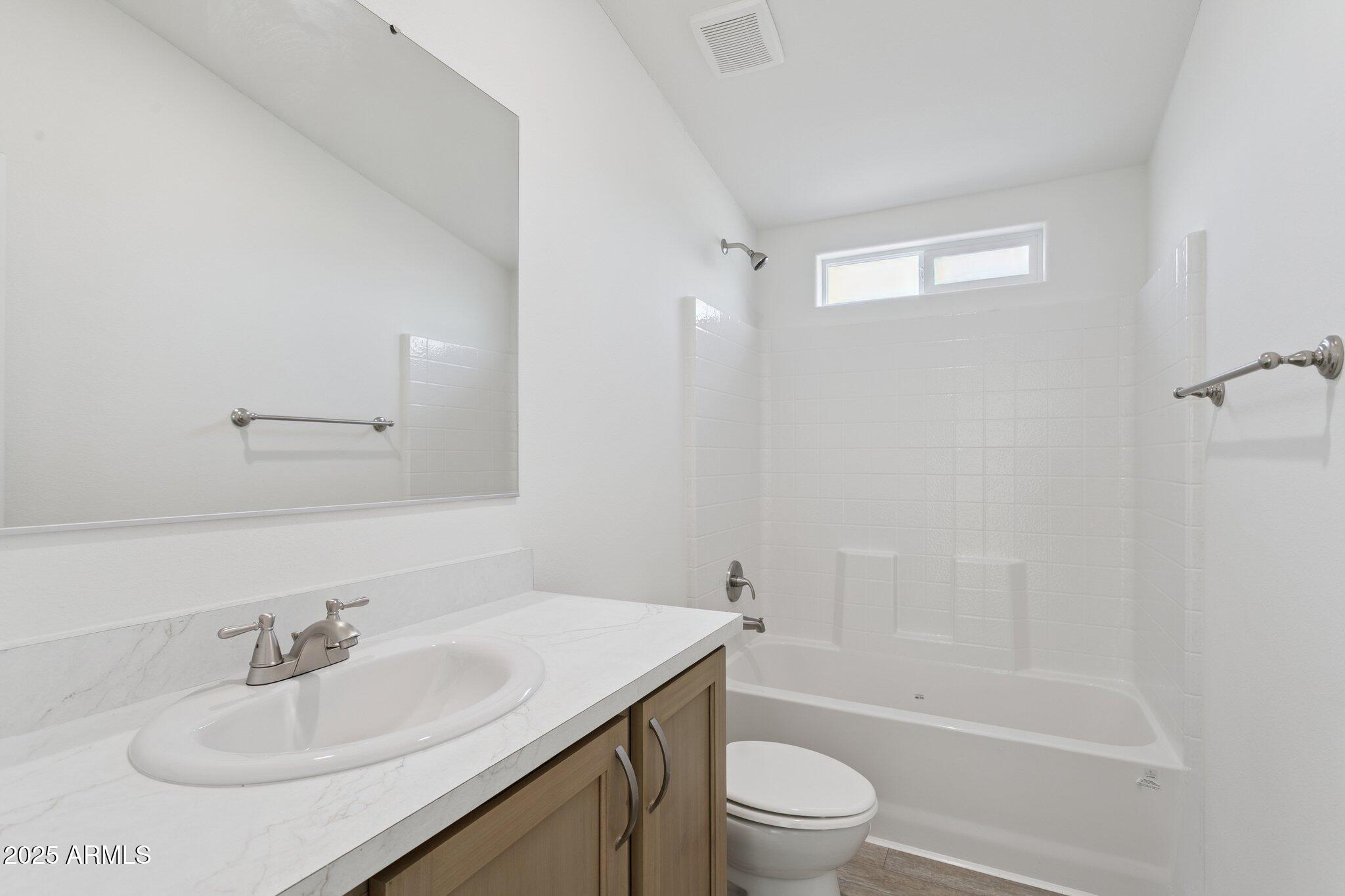 755 North Ralston Road Maricopa, AZ 85139 - Photo 28 of 34 a bathroom with a sink toilet and shower