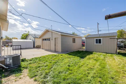 a view of a backyard of the house