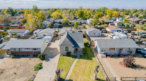 an aerial view of a house with a swimming pool