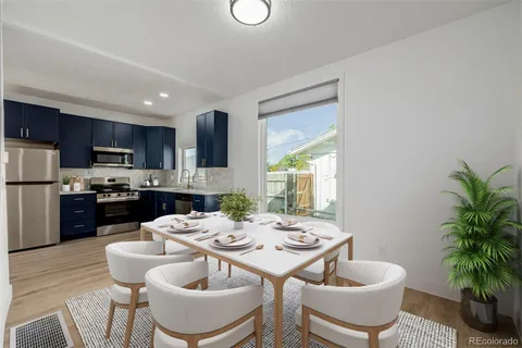 a kitchen with a table and chairs in it