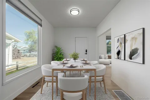 a dining room with furniture and window