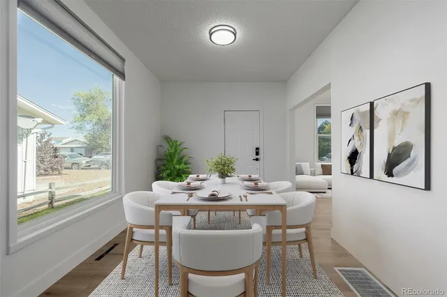 a dining room with furniture and window