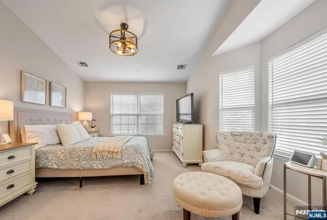 a bedroom with a bed and a couch