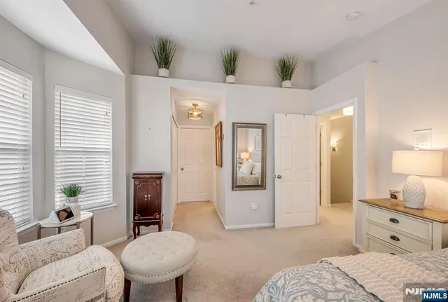 a spacious bedroom with a bed and a couch