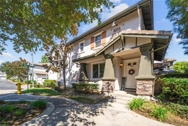 a front view of a house with garden