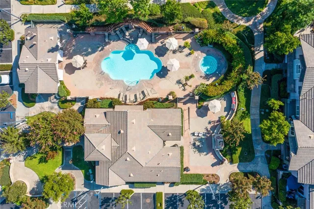 an aerial view of multiple houses with yard