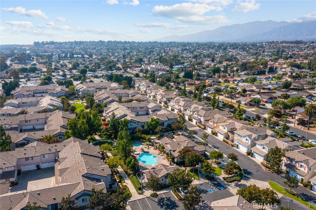 8055 Pueblo Place, Unit 101 Rancho Cucamonga, CA 91730 - Photo 30 of 30 an aerial view of a city with lots of residential buildings
