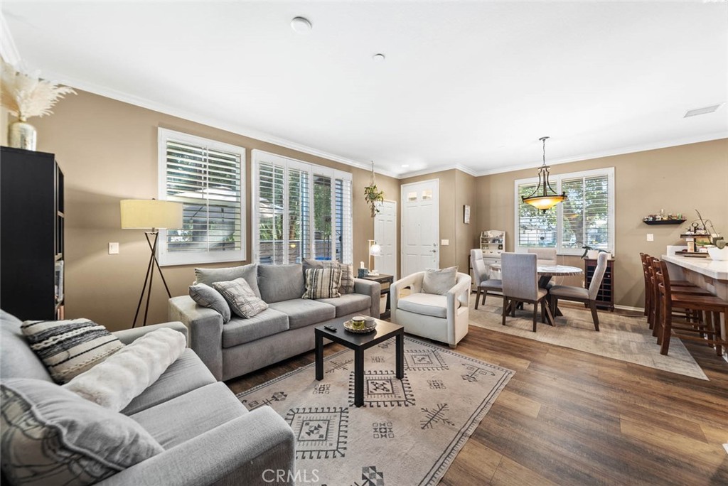 8055 Pueblo Place, Unit 101 Rancho Cucamonga, CA 91730 - Photo 3 of 30 a living room with furniture and a large window