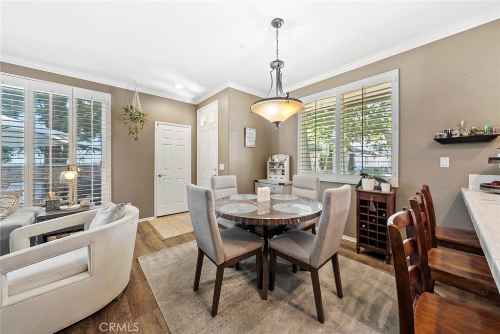 8055 Pueblo Place, Unit 101 Rancho Cucamonga, CA 91730 - Photo 6 of 30 a view of a dining room with furniture window and outside view