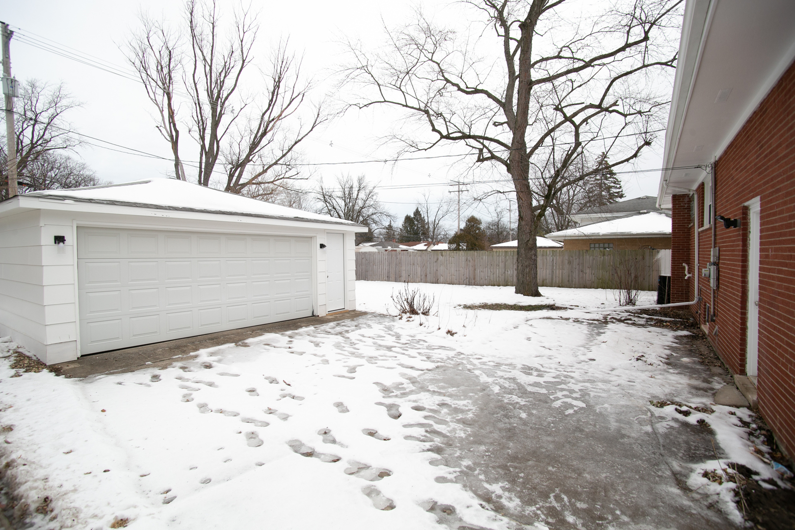 1232 Evergreen Road Homewood, IL 60430 - Photo 3 of 27 a view of garage and a snow