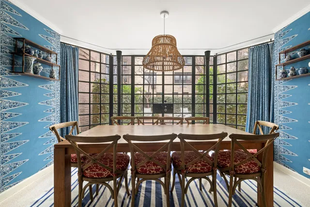 a backyard of a house with fire pit and couch