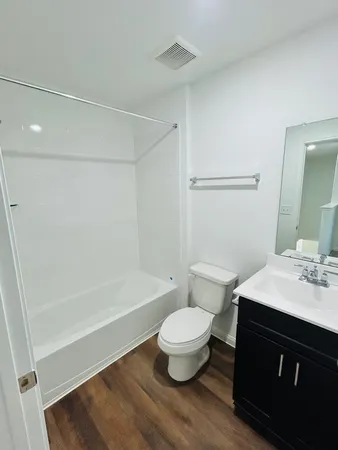 a bathroom with a sink a toilet and a bathtub