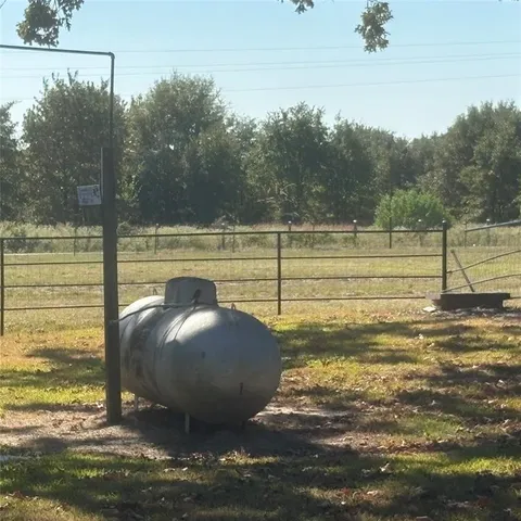 a view of a swimming pool with an outdoor space and seating area